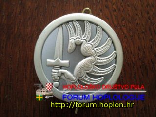 France - beret badge of 2nd Foreign Parachute Regiment.jpg