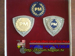 Macedonia - police hat badges.jpg